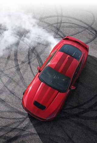 Overhead view of a 2024 Ford Mustang® model with tire tracks on pavement | Burlington Ford in Burlington CO