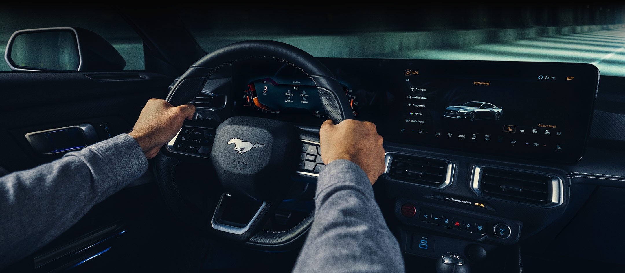A 2024 Ford Mustang® model interior with a person driving | Burlington Ford in Burlington CO